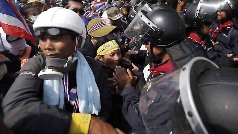 Thai PM under siege, lengthy protests take toll on economy