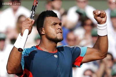 Jo-Wilfried Tsonga beats Gael Monfils to advance at Japan Open