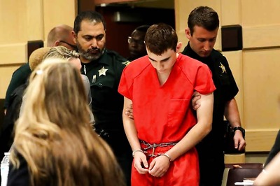 Head Bowed, Florida Shooting Suspect Returns to Court for Hearing