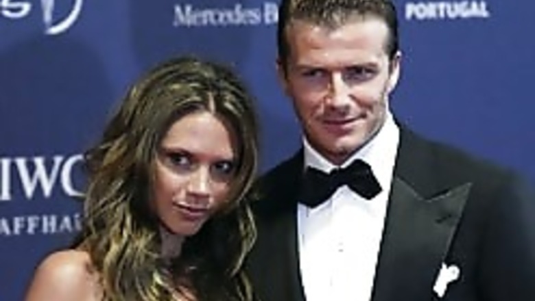 Beckham spotted groping Posh's bum