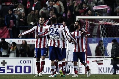 In-form Atletico Madrid seek to pile pressure on Barcelona