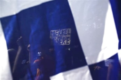 Thousands protest as Greece votes on bailout bill