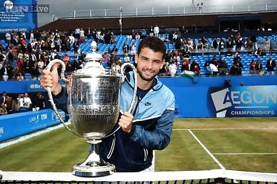 Dimitrov saves match point to win Queen's final