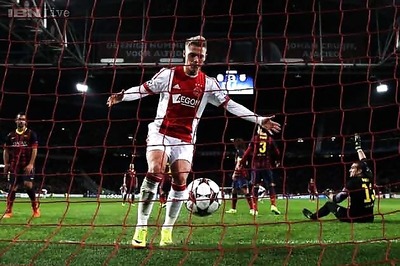 Ajax end Barcelona unbeaten run to stay in contention