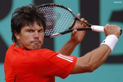  Dent upsets Lopez, sets up meeting with Nadal