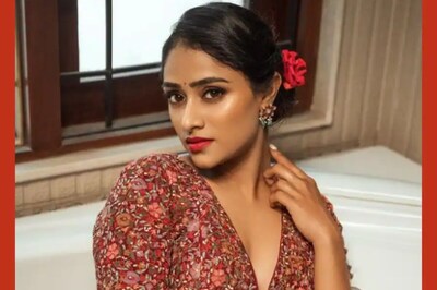 Actress Sangeetha Sringeri Drapes Silver And Red Saree For Bathtub Photoshoot