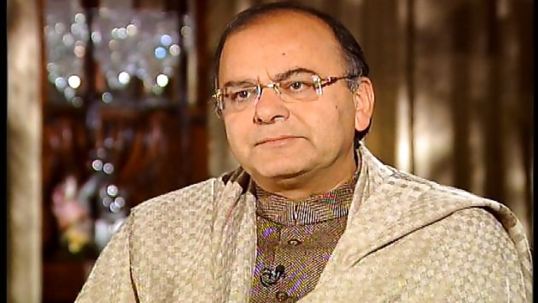 India seeks to calm investor jitters, stands firm on back taxes