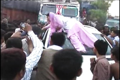 Watch: Woman smashes SP leader's car after his guard winked at her