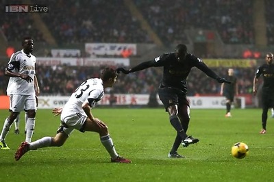 Manchester City stay on course with 3-2 win over Swansea