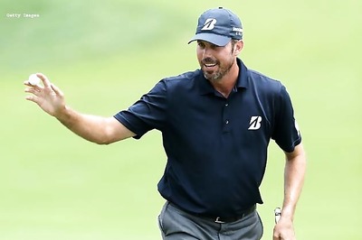 Kuchar moves two ahead at windy Memorial