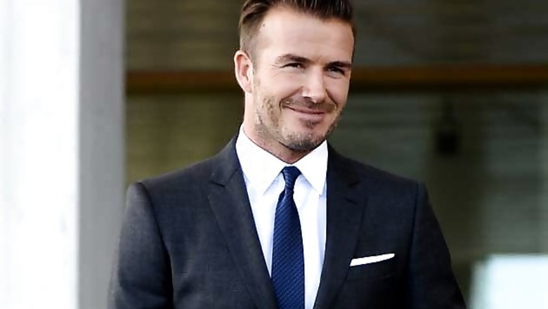 Soccer star David Beckham and son unhurt in UK car crash