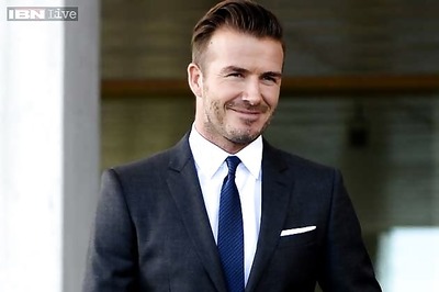 Soccer star David Beckham and son unhurt in UK car crash