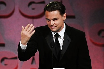 DiCaprio bumps into a topless lady in the sea