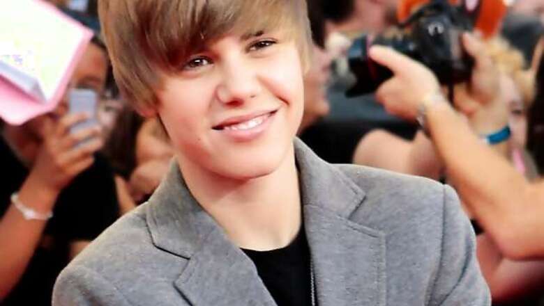 Justin Bieber leaves night club with waitresses after a brawl