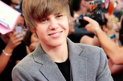 Justin Bieber leaves night club with waitresses after a brawl