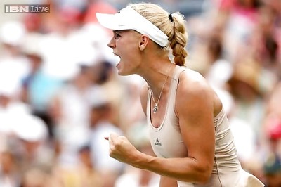 Caroline Wozniacki outlasts Maria Sharapova, moves into US Open quarters