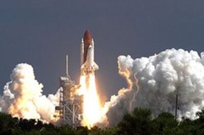 Patched-up Atlantis blasts off