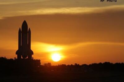 NASA clears shuttle for launch, weather improving