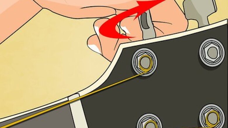 How to Change Strings on an Acoustic Guitar Without Pins