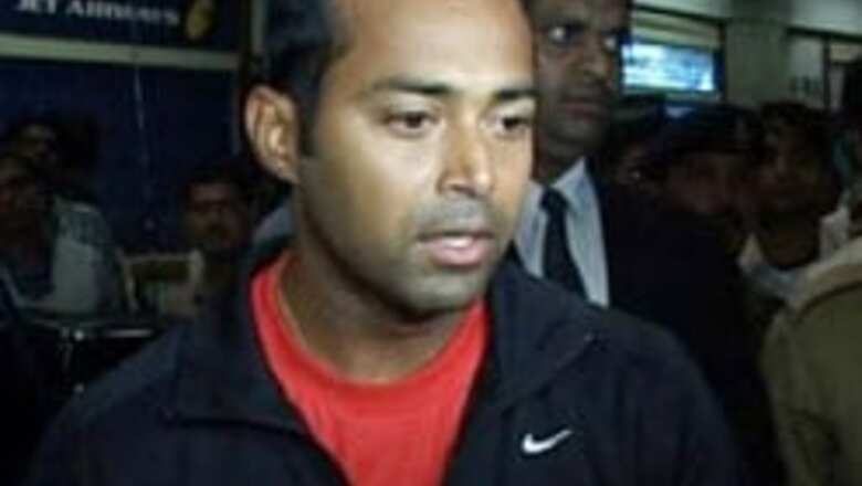 Paes advances in mixed doubles