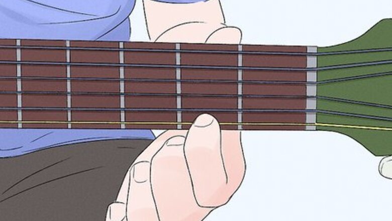 How to Play a Bm Chord on Guitar