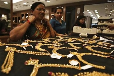 Gold surges most in 2 years; up Rs 1,310 as rupee, stocks tumble