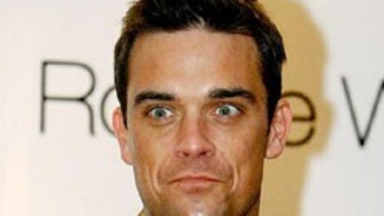 Robbie Williams to sing with Asha