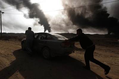 Cornered Islamic State builds huge defences, torches oil wells to defend Mosul