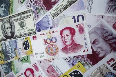 Currency war fears ease; oil hits six-year low