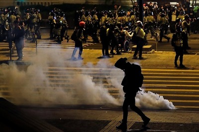 Hong Kong Police Fire Tear Gas to Break Up Christmas Eve Protest Chaos
