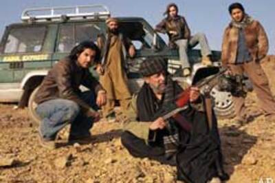 Afghans express anger, ban Kabul...
