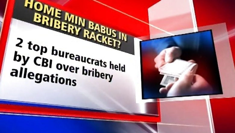 Two bureaucrats arrested on bribery charges