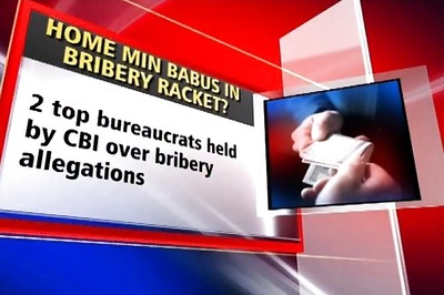 Two bureaucrats arrested on bribery charges