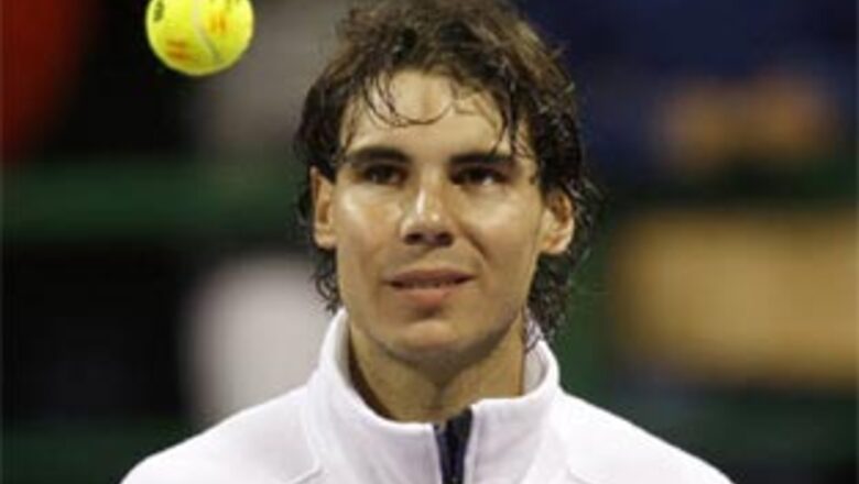 Federer survives scare, Nadal through in Qatar