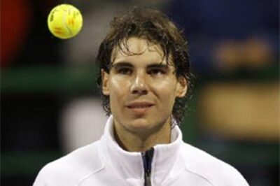 Federer survives scare, Nadal through in Qatar