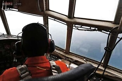 Search team pilot says he saw bodies of victims 'holding hands' at the AirAsia QZ8501 crash site