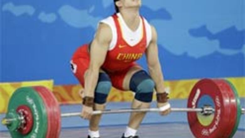 China's Cao overcomes mother's death, lifts gold
