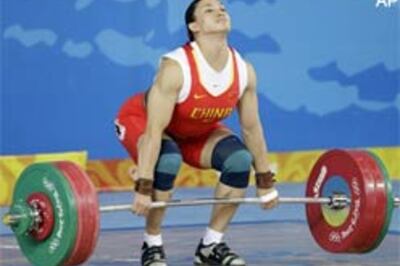 China's Cao overcomes mother's death, lifts gold