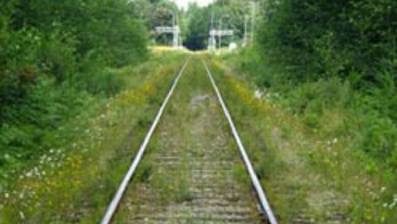 Angry man lies down on railway tracks