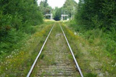 Angry man lies down on railway tracks