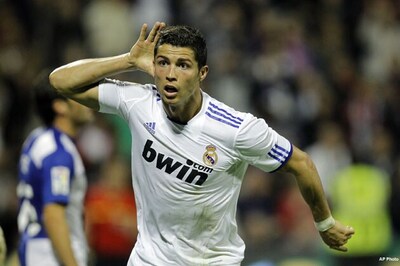 Ronaldo scripts Real comeback, Barca rout Sevilla