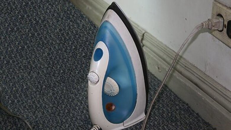 How to Remove a Carpet Stain With an Iron