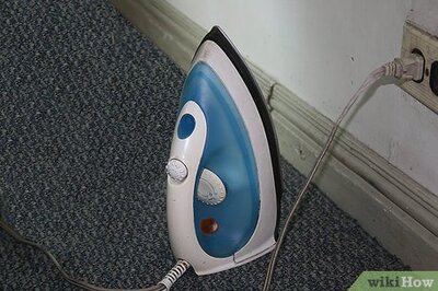 How to Remove a Carpet Stain With an Iron