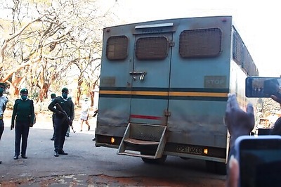 Zimbabwe court orders chains removed from jailed journalist