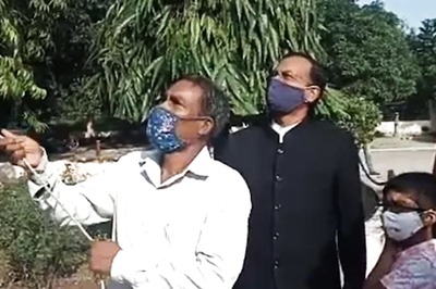 Peon Hoists Flag During Independence Day Celebration in Varanasi