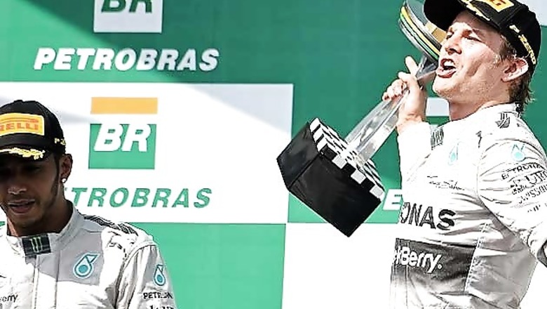 Nico Rosberg holds off Lewis Hamilton to win the Brazilian GP