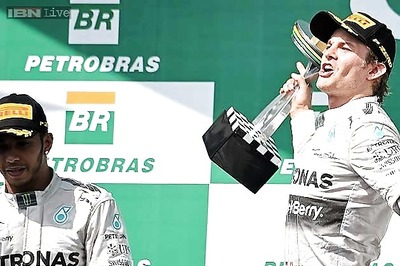 Nico Rosberg holds off Lewis Hamilton to win the Brazilian GP