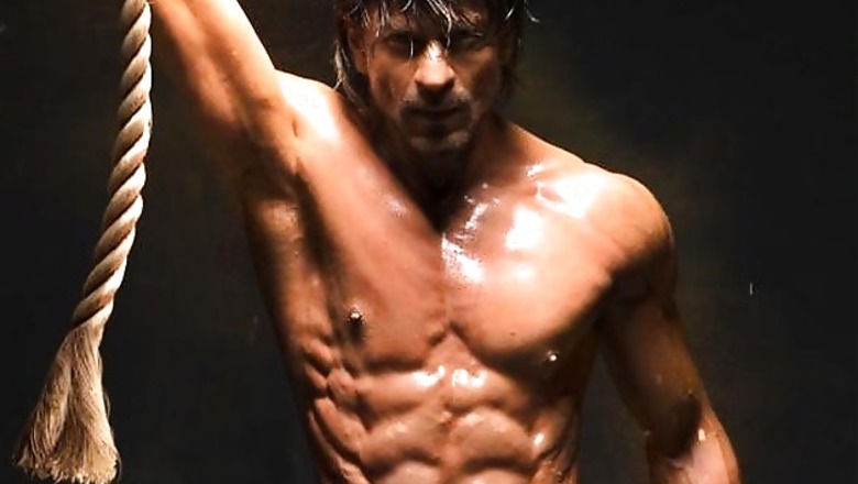 48-year-old Shah Rukh Khan shows off his newly-sculpted 10-pack abs for Farah Khan's 'Happy New Year'