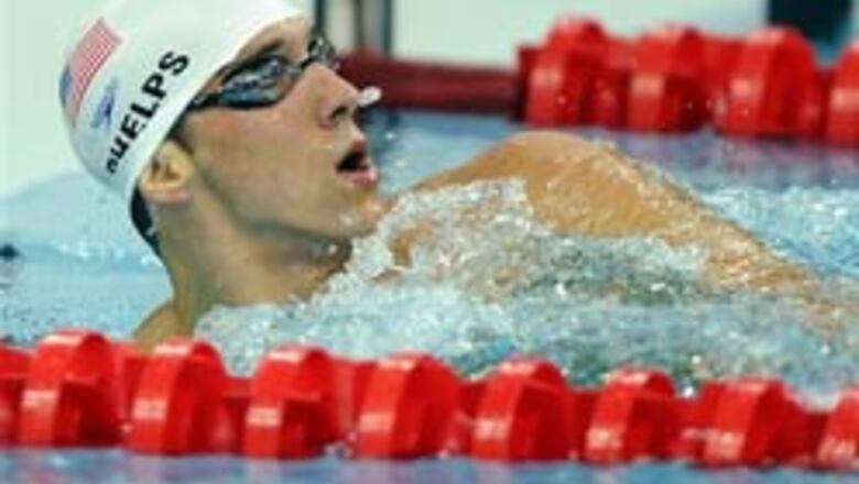 Phelps sets new Olympic 400m IM record