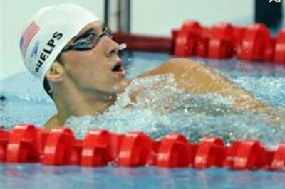 Phelps sets new Olympic 400m IM record